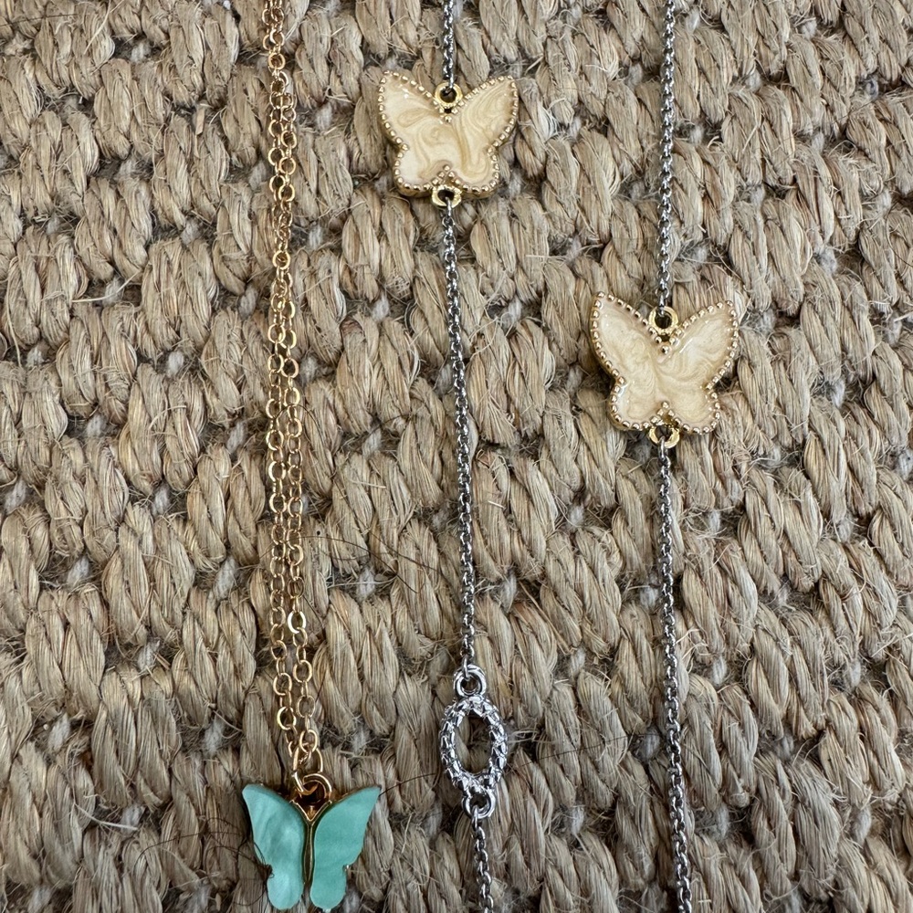 Two nwot Butterfly Pendant Necklaces. One 8 inch and one 17 inch